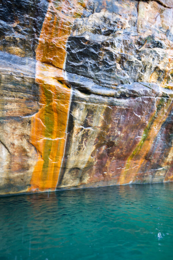 Stained Cliff With Lake Superior Blue Portrait